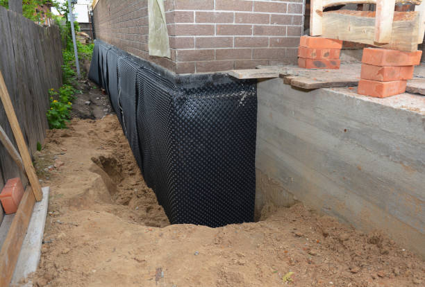 Happy homeowners after waterproofing job in Buhler